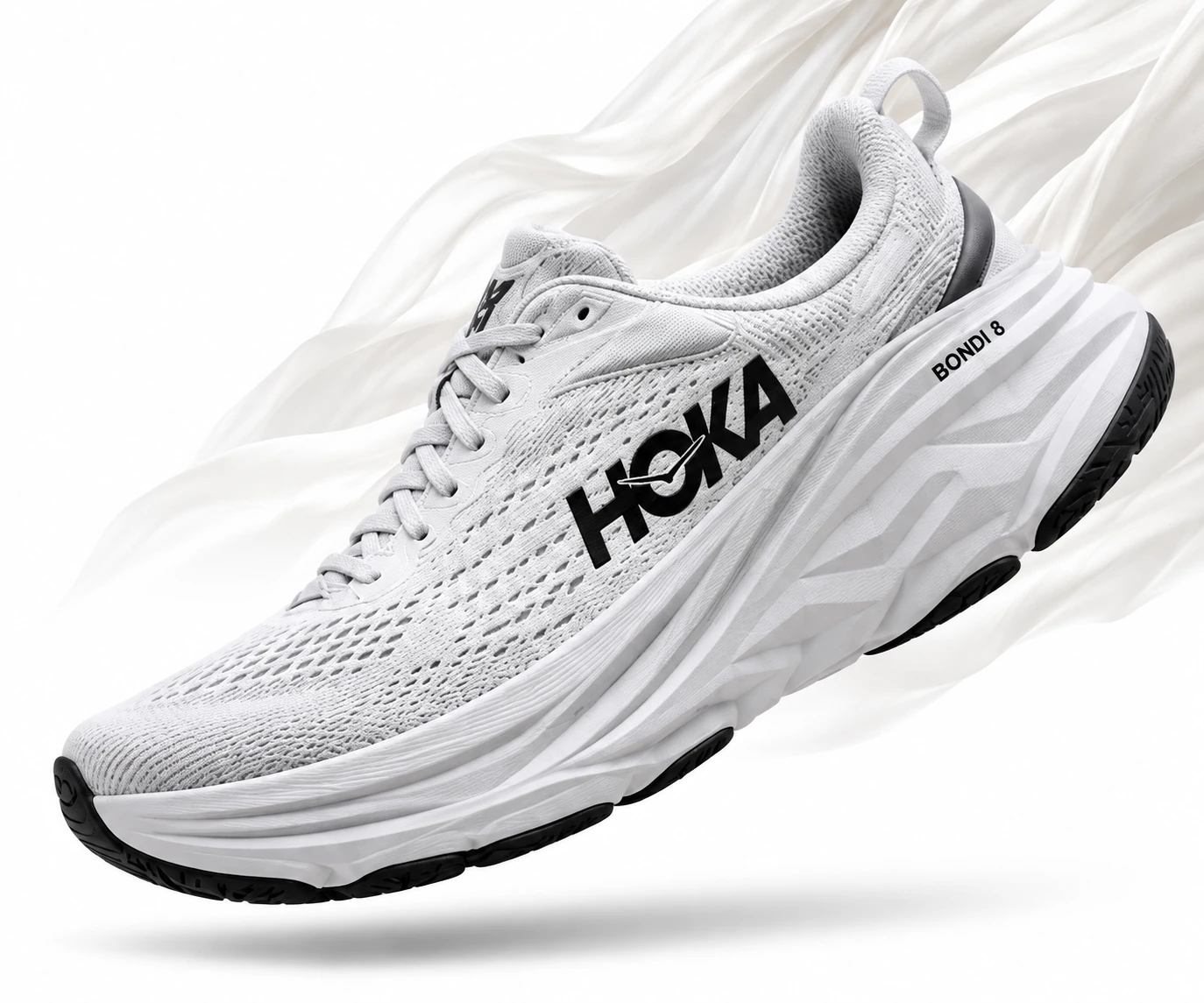 Белые HOKA Bondi 8 на фоне лёгкой ткани